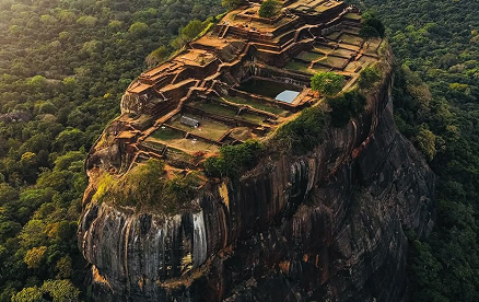 Sigiriya rock fortress surrounded by lush green forests of Sri Lanka