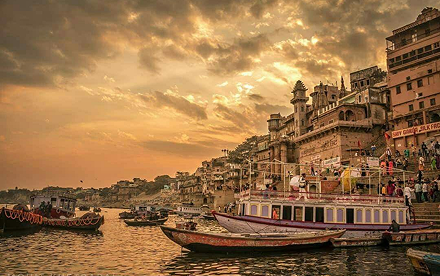 Kashi ghats at sunset with boats on the sacred Ganga
